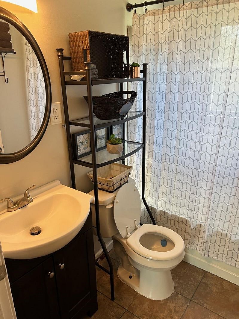 Full bathroom with a bathtub shower combo. The tub is a deep porcelain for added relaxation.