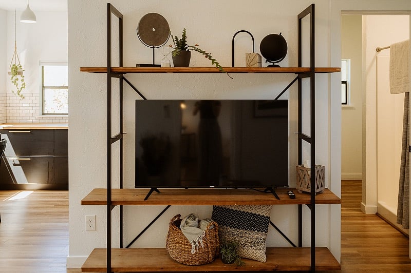 Smart TV and entrance to the bathroom on the right