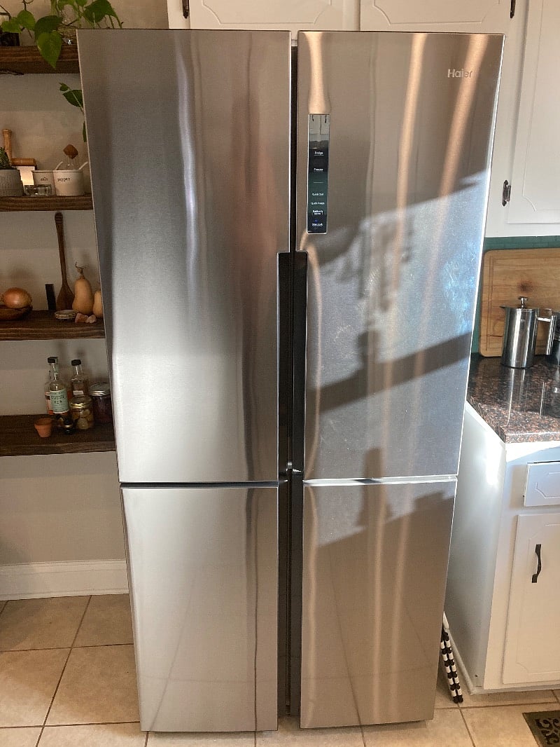 New stainless Haier fridge with quad French Doors