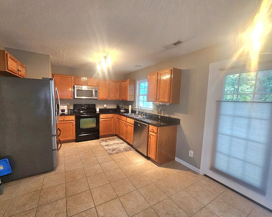 Large eat in kitchen attached to walk out deck