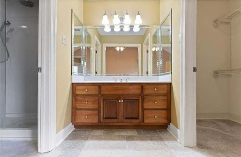 Master Bathroom, to the left is a three shower head shower with rainfall shower head