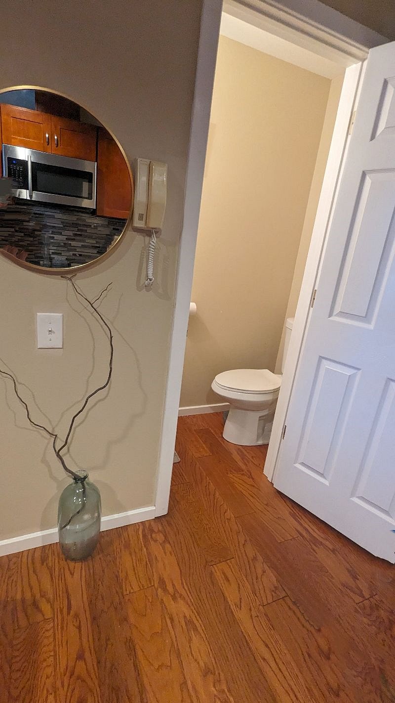Half bathroom upstairs, near kitchen.