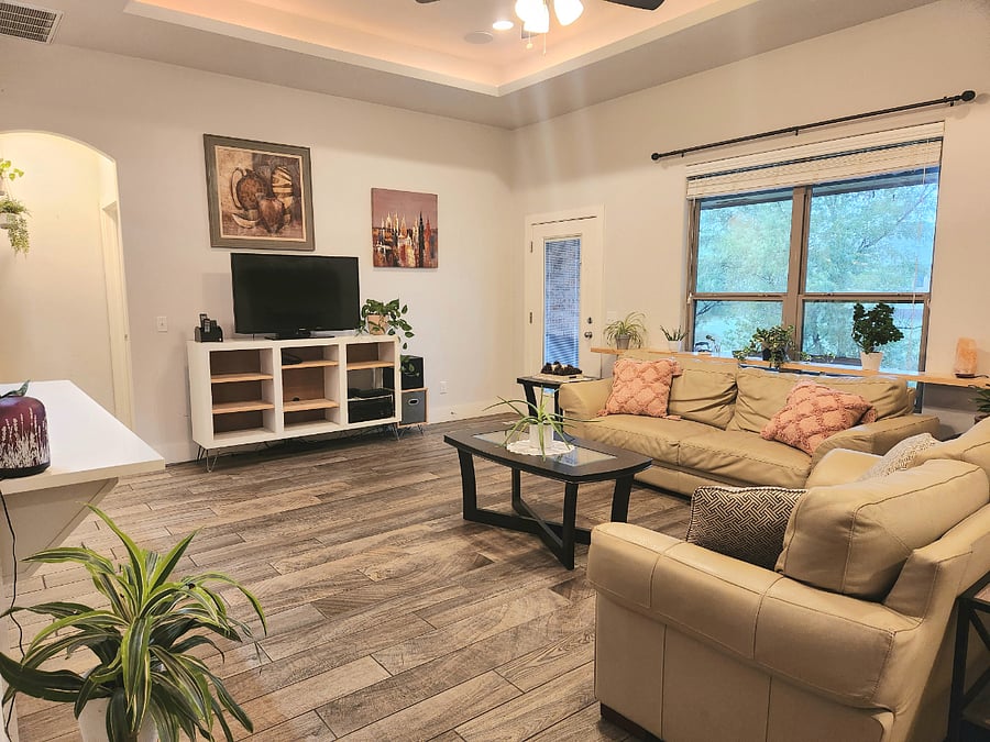 Living room with built-in speakers and surround sound system.
