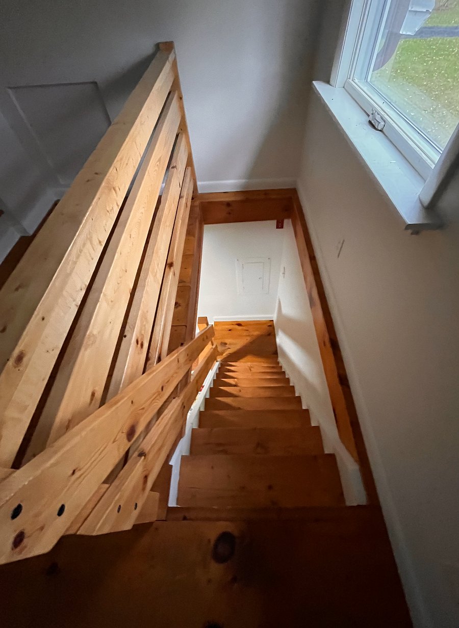 New banister and railing, looking down from the loft