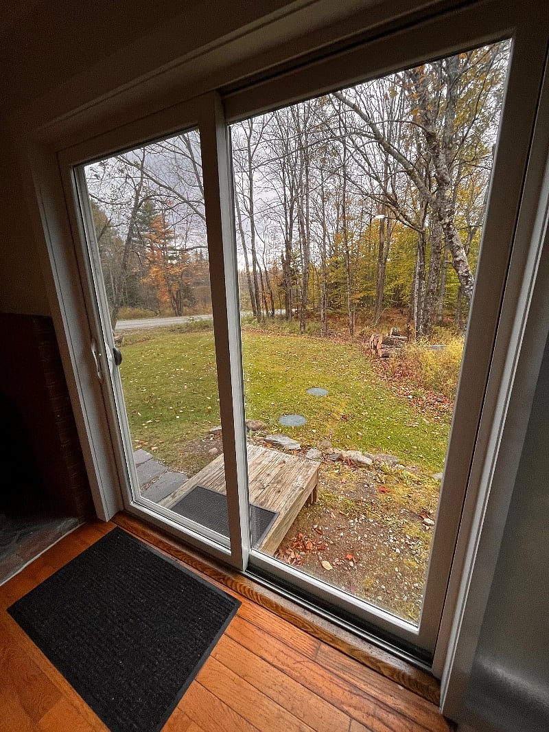 Brand new sliding glass doors to side yard, facing West