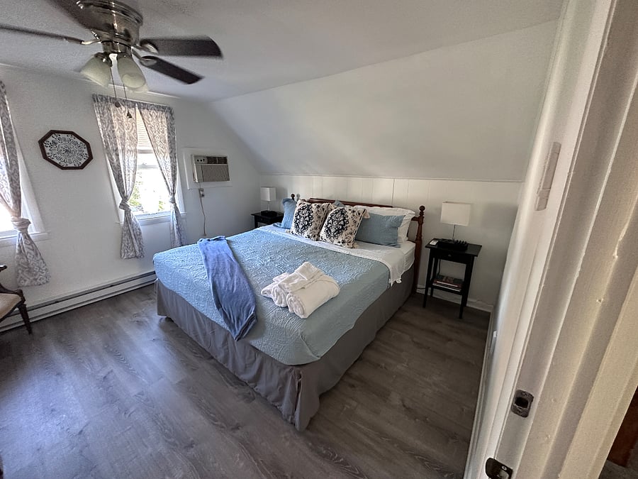 Primary bedroom with king size bed.