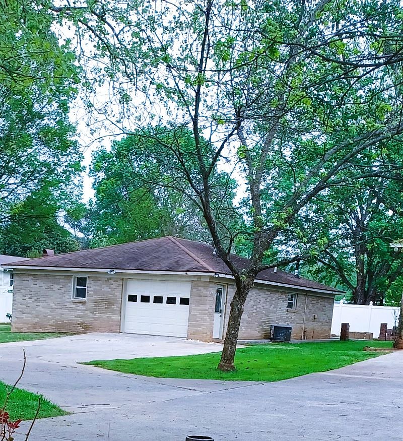 Exterior view from the driveway
Garage with remote opener fits most vehicles.  3 camping chairs (stored) for use at the firepit