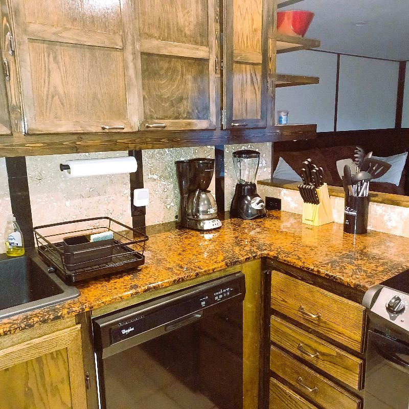 Kitchen utensils and gadgets-coffeemaker & blender.
Backsplash is LED Iit.