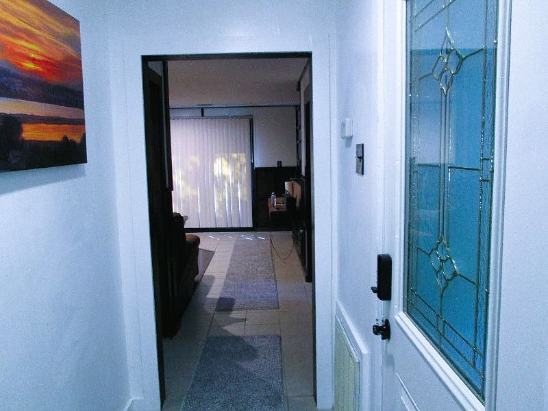 View from Hallway at Bedroom 2 doorway.  French doors open onto patio with firepit.  French doors are key locked and are easily locked unlocked - see house book for details.

