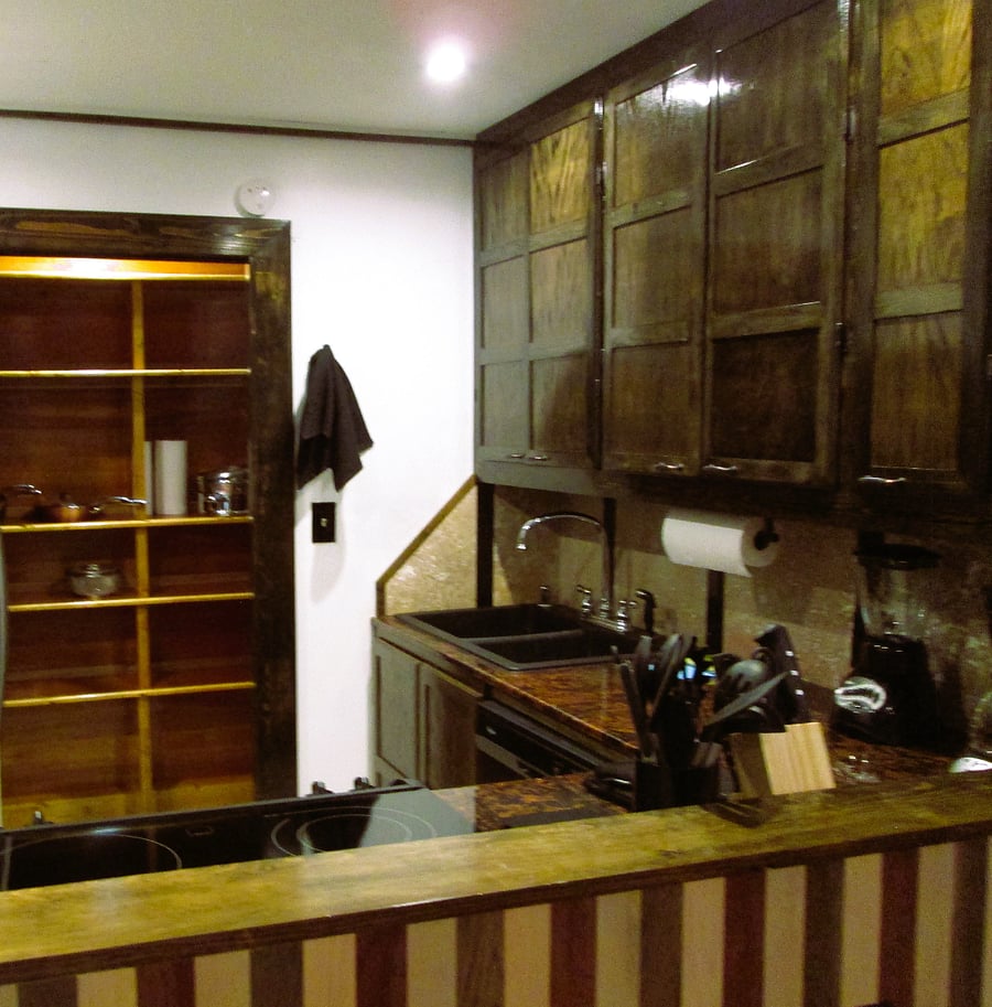 View from Drop zone (work space).  Pantry stores all the needed cleaning supplies as well as the microwave and toaster, baking set and pots and pans.