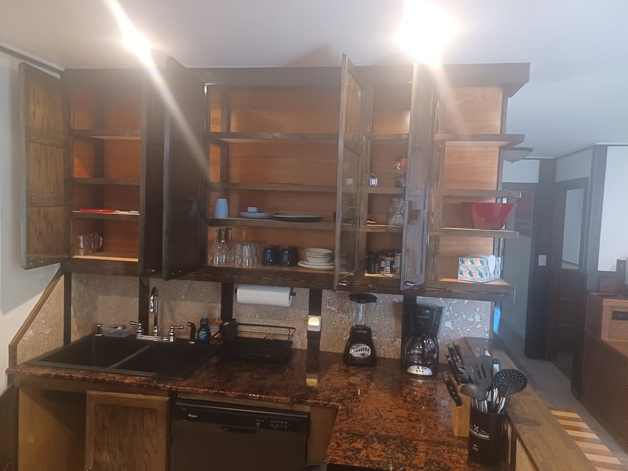 Bathroom with lots of storage.  Middle cabinets house the 4 place settings.
Left cabinets have extra glasses
Right Cabinet - is contributions from previous guests, spices and canned goods
