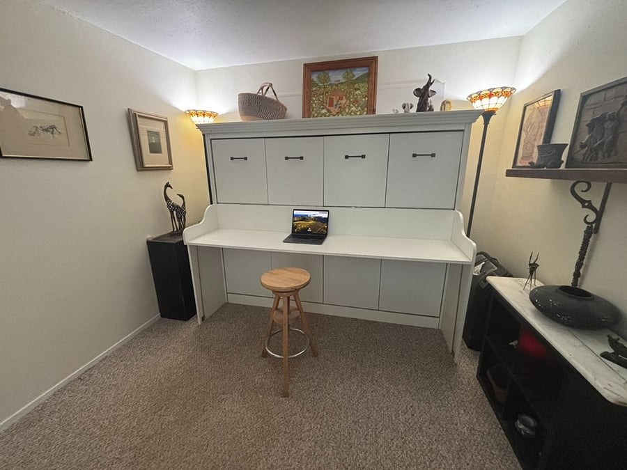 The Safari room with the desk in use with in the main house