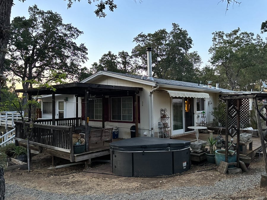 Front, side, and back decks surrounding the home. Have a peaceful moment in our relaxing hot tub after your day's events.