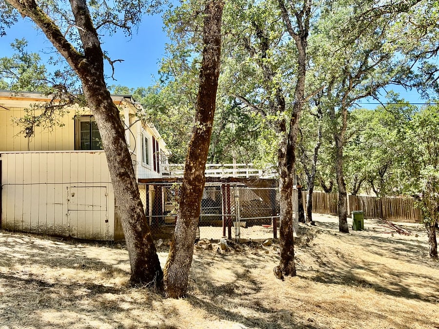 The private deck and entrance to the Countryside Quarters room with a view of the outside dog run where your best friend can sleep in comfort