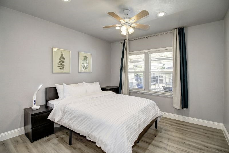 All our bedrooms feature black-out curtains, dimmable recessed ceiling lights, ceiling fan, wireless phone charging lamp with USB.