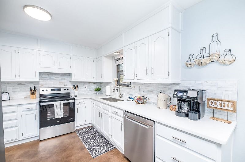 The cozy kitchen has everything one will need to cook meals. Quartz countertops and stainless steel appliances make for a pleasant environment.