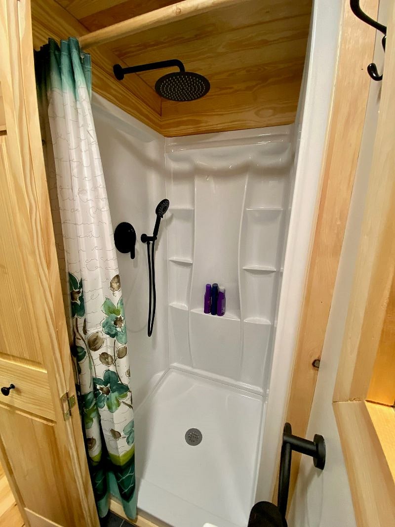 Shower with rain shower head. On-demand hot water never runs out!