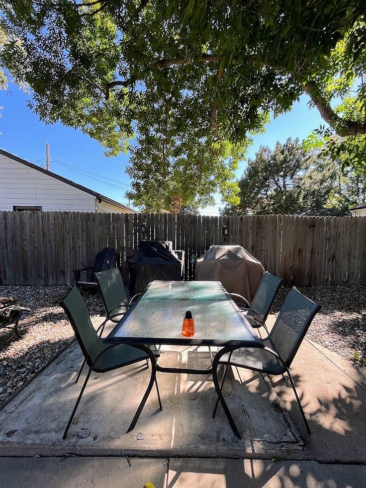 Outdoor dining area with gas grill