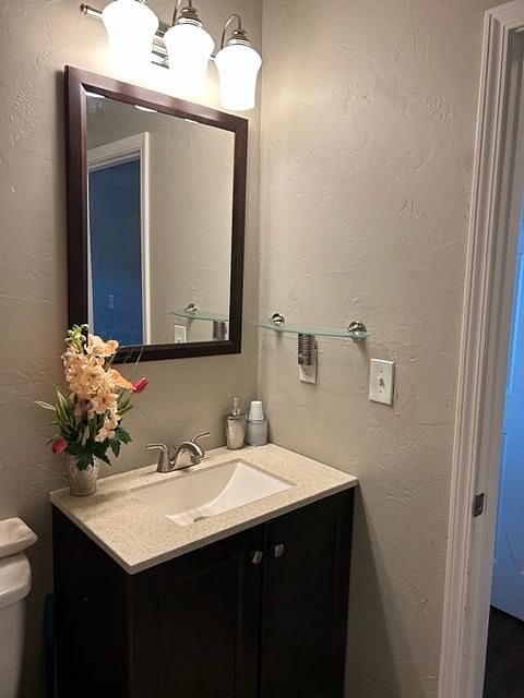 Newer vanity with plenty of lighting.