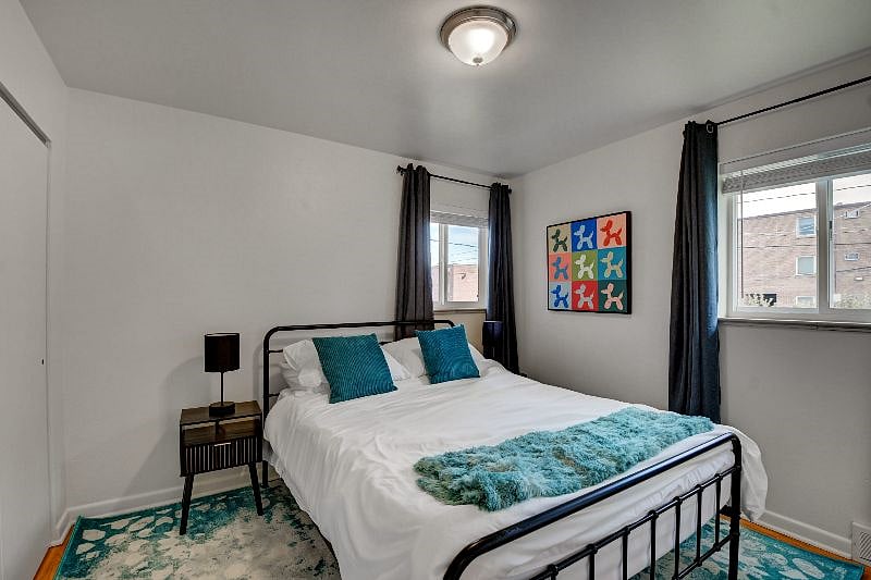 Queen bed with comforter, cozy pillows, comfy mattress and dresser in closet. Lamps with phone charging station. Blackout curtains.