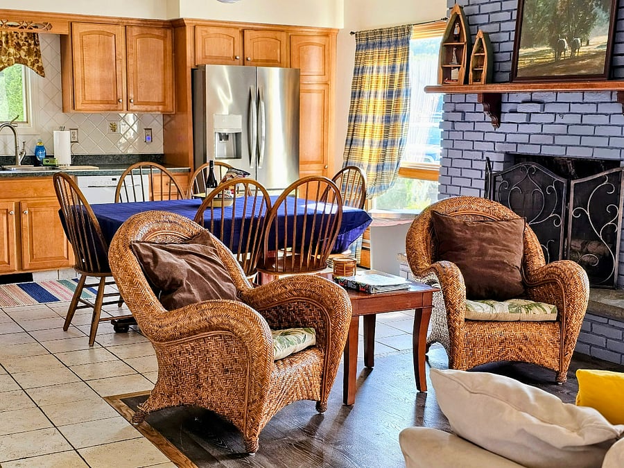 Open concept living room, dining room and kitchen with ample views of Saratoga Lake.