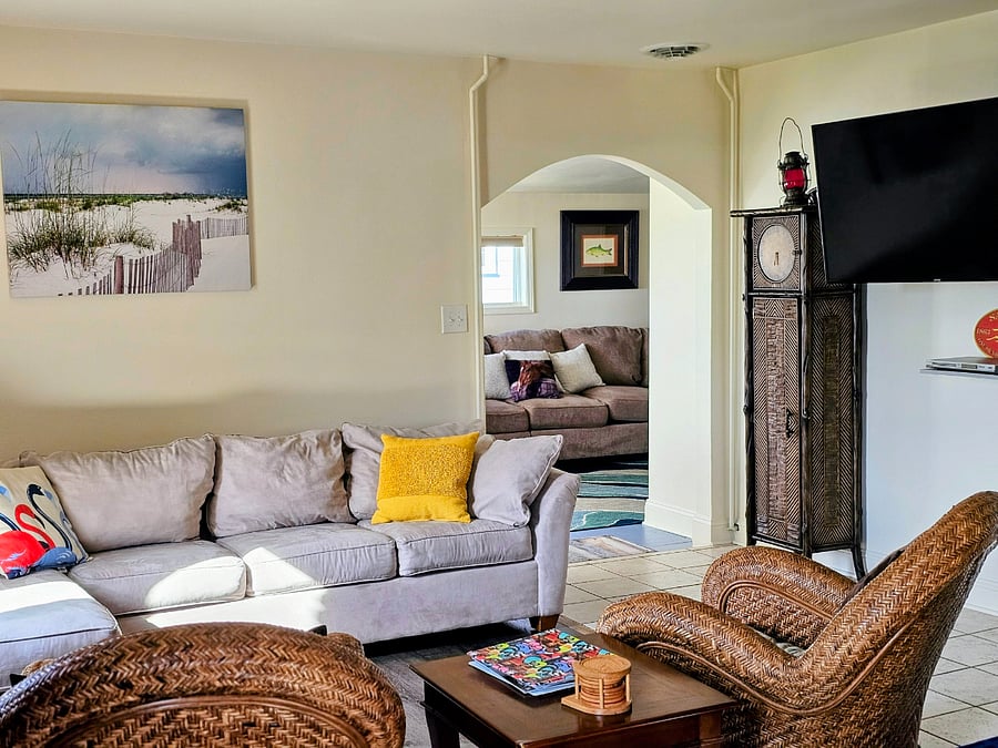 Smart tv on swivel so TV can be viewed in living room, dining room, and kitchen.