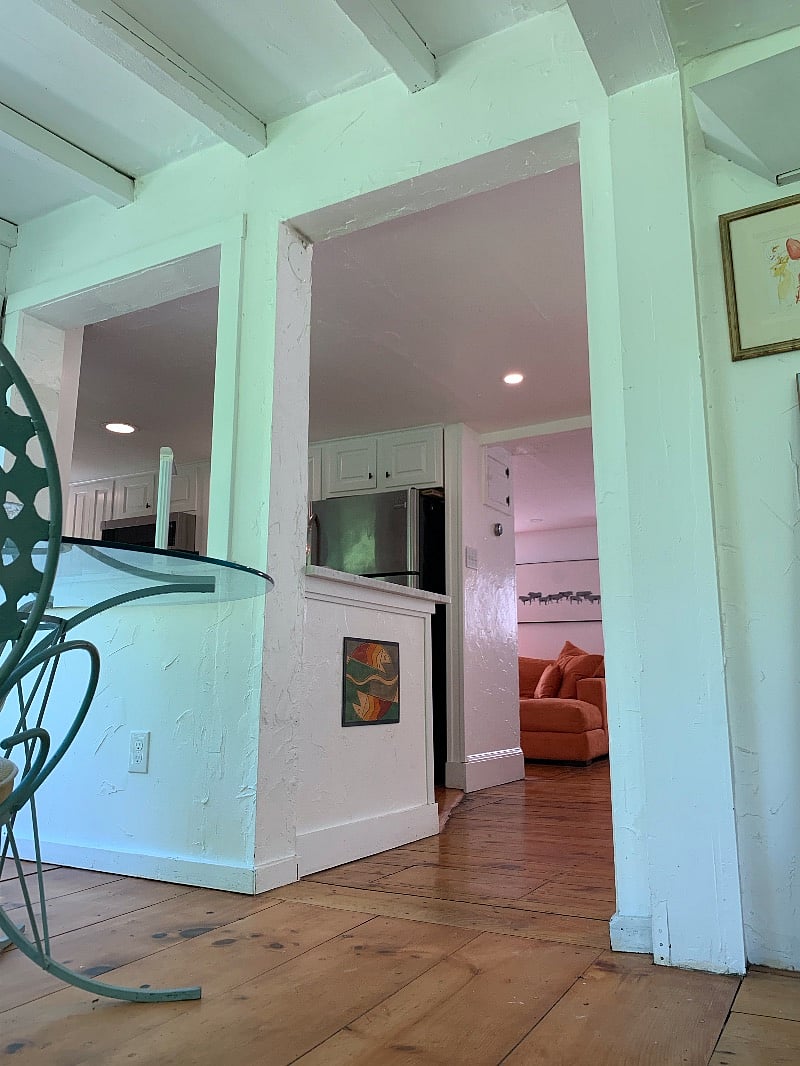 View from dining area, past the kitchen, toward the living room.
