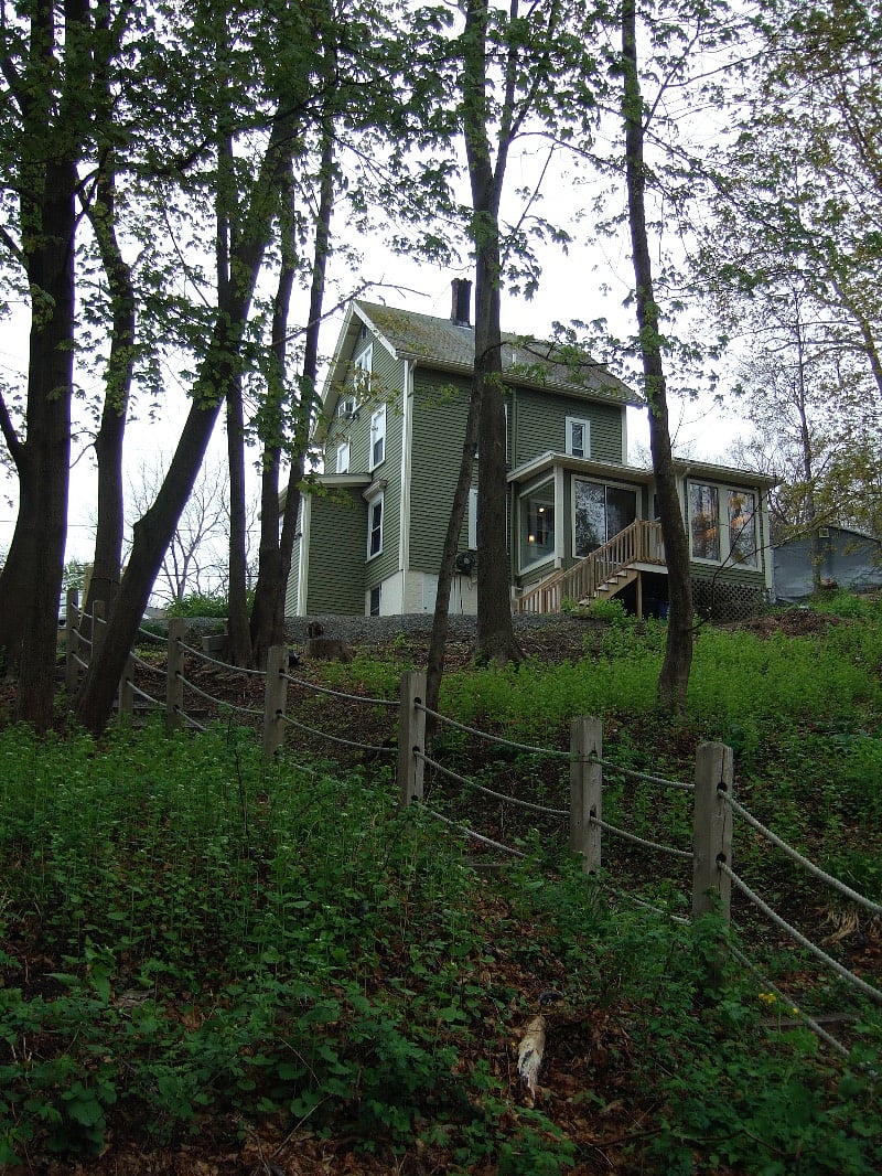 View of house from bottom of the property, abutting street below.