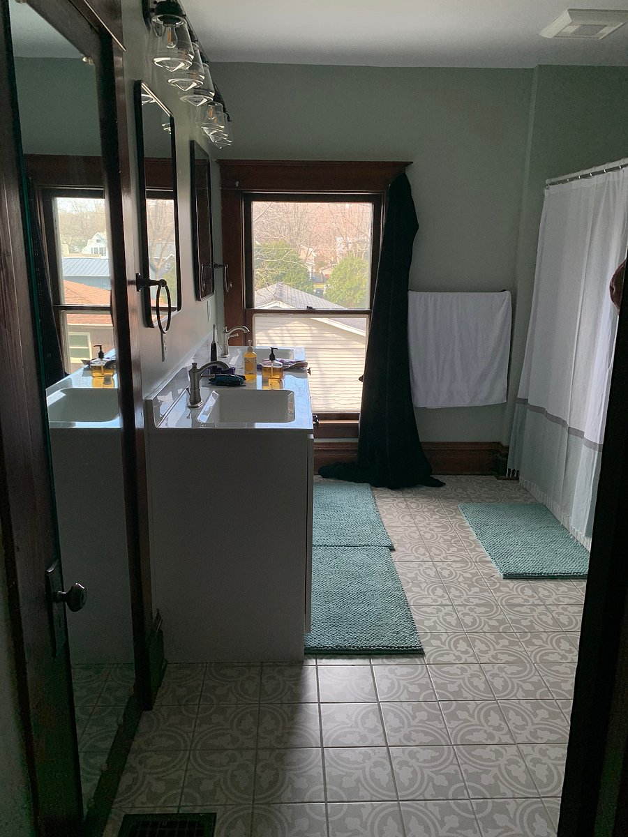 2nd floor bathroom with shower/tub, 2 sinks, large storage closet and toilet. 