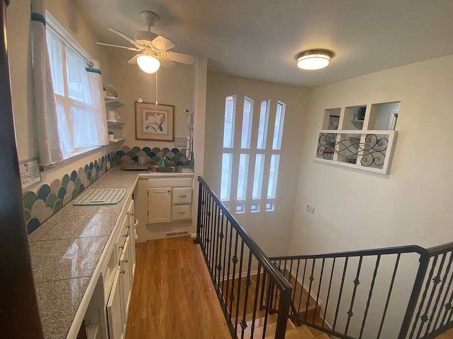The kitchenette has a mini fridge, sink, microwave, toaster, coffee pot, basic dishes and utensils, and microwave cookware.  
