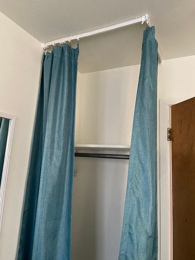 This hanging bar with a shelf above is the closet for Bedroom 1.  The curtains can be closed ...or not...as you like.