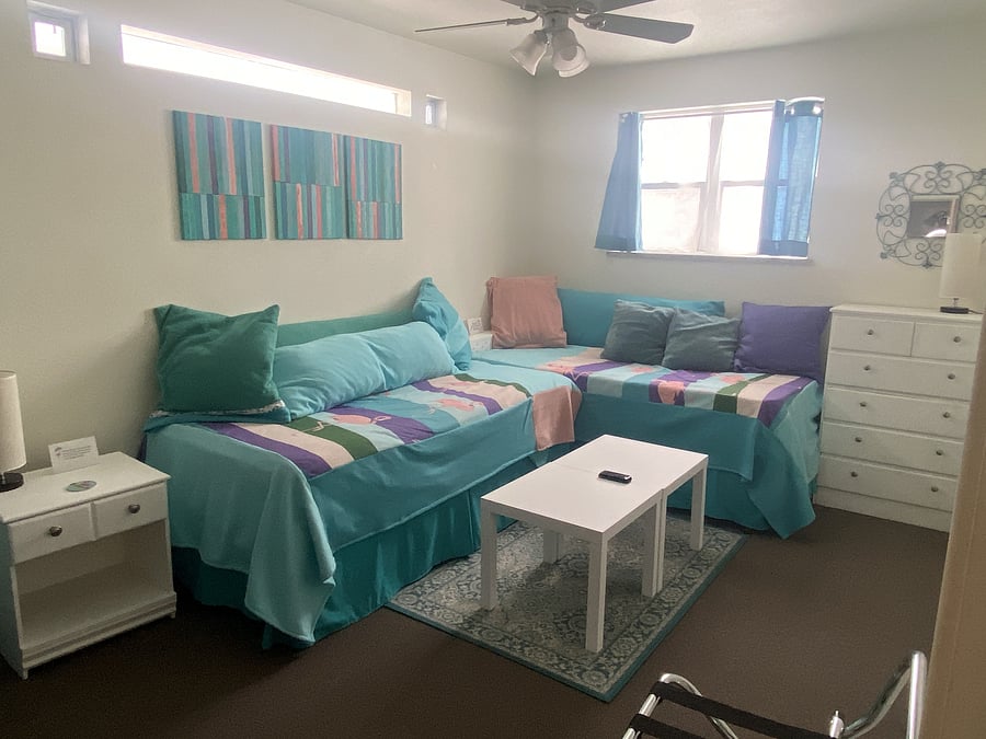 Bedroom 2.  10 x 12.  It has three set-up options: This is the hang-out option.  Other than this set-up, there is no living room in the unit.  The other two set-up options for this room are shown below: the split king or two twins.  TV, dresser, full closet, attached bathroom with tub.