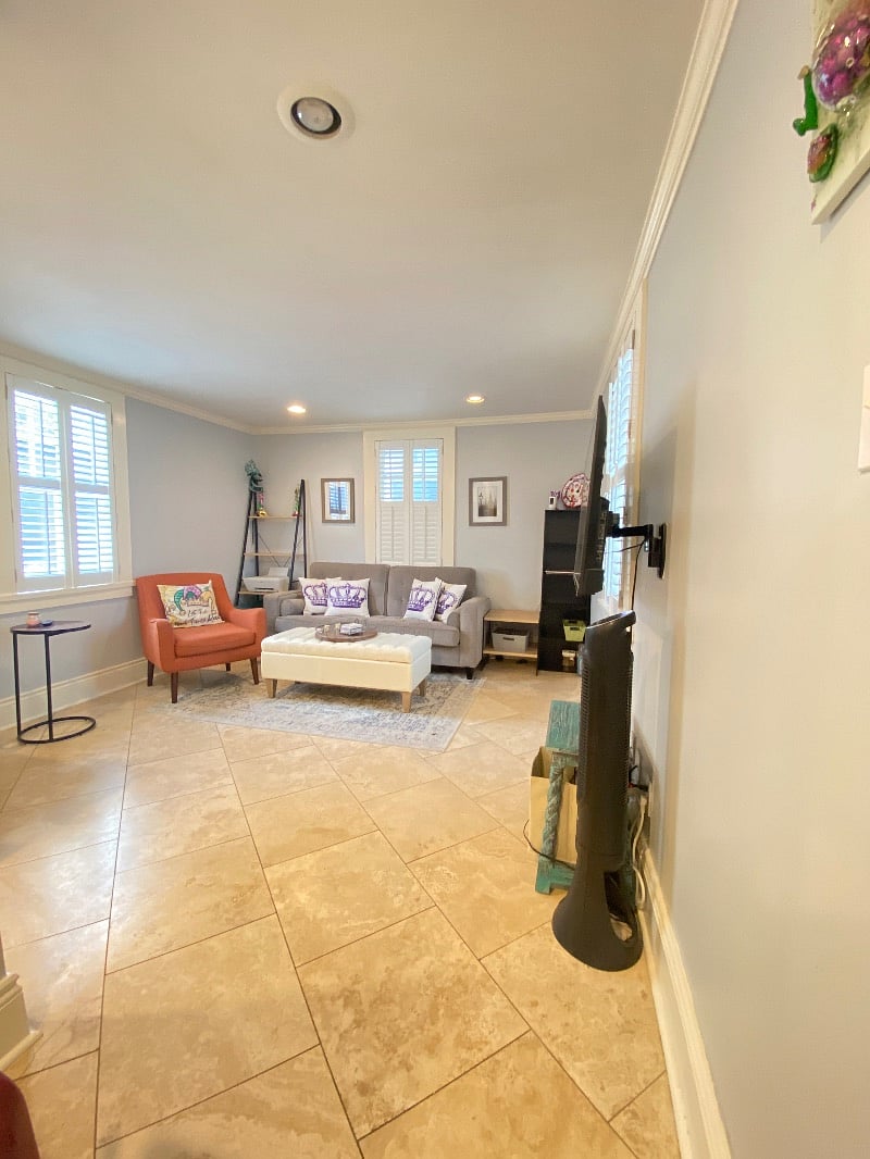 Living Room w/empty book shelves and storage ottoman