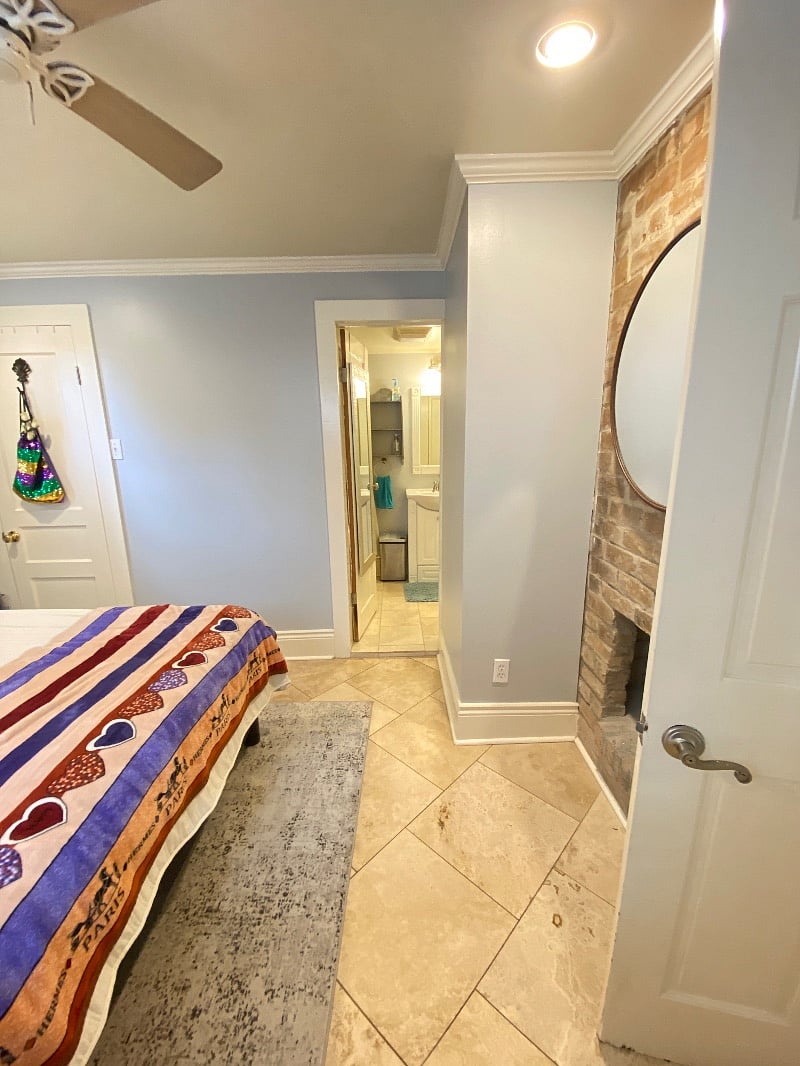 Bedroom with entrance to bathroom and door to walk in closet
