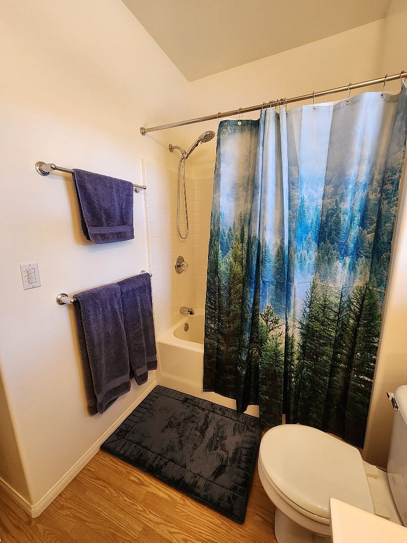 Large bathroom with a good size tub to relax in.