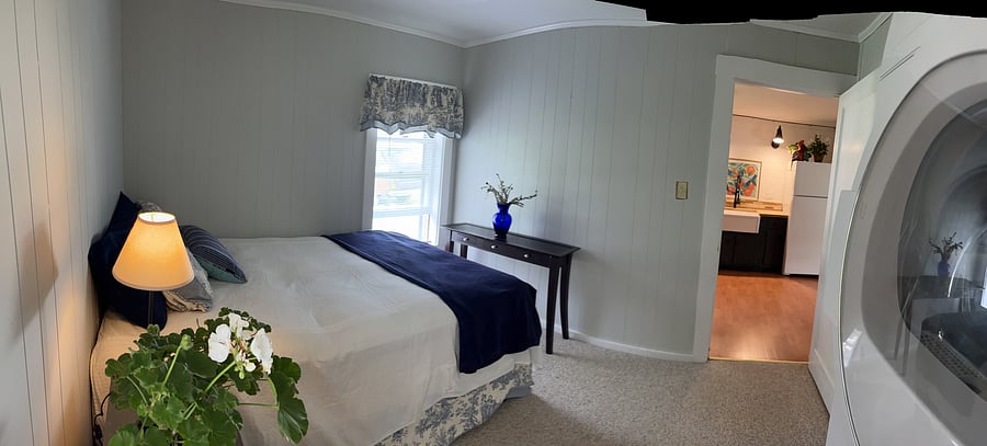 Bedroom. Window with room darkening shades faces front of house
