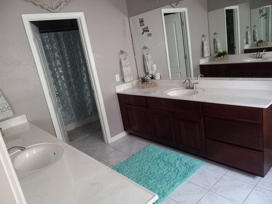 Jack n Jill Bathroom with separate sinks and cabinets. Shower/ tub and toilet is separate from the common vanity area for your privacy.