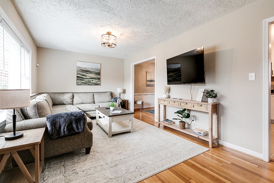 Large living room with oversized sectional you can relax and sink. 55" UHD TV.