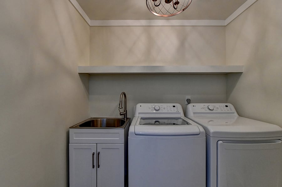 Large Laundry Room with Utility Sink and Brand New Washer and Dryer