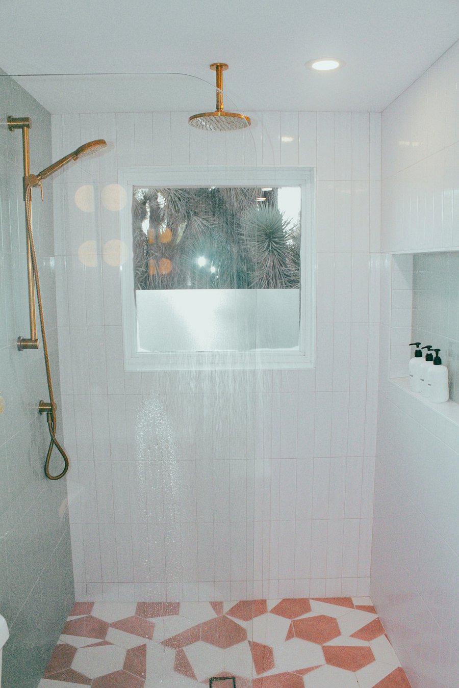 Relax in the walk-in rain shower with stunning views of the Yuccas outside your window.