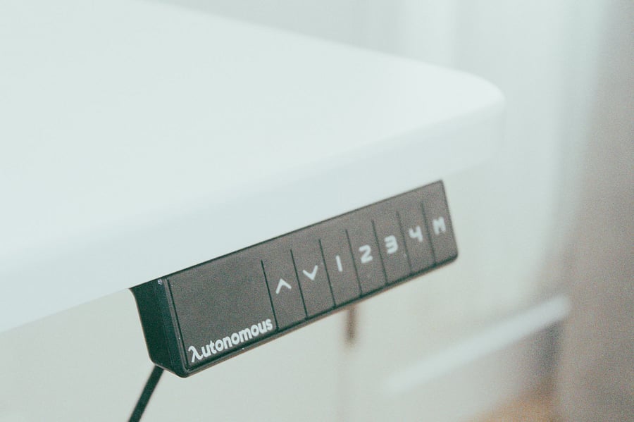 Work while sitting or standing with the Autonomous standing desk and chair.