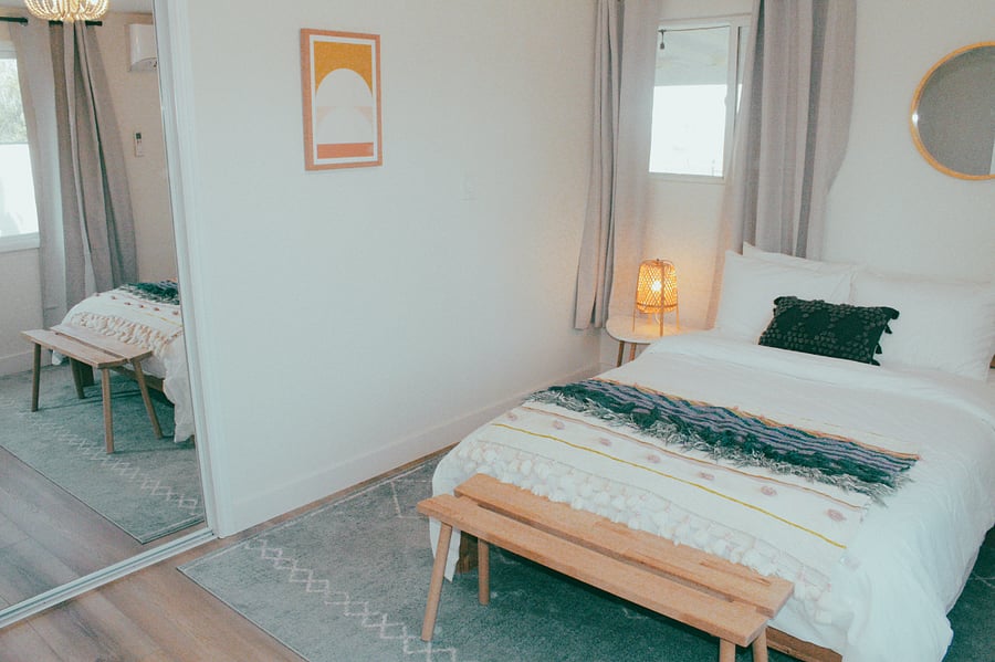 Second bedroom with full-sized bed and Parachute brand linens.