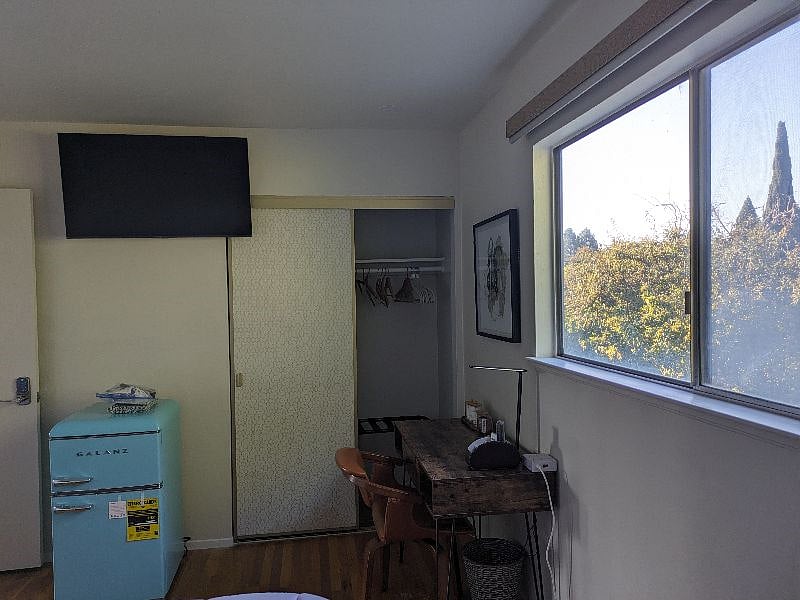 RKB Room - Closet with Hangers, 42" Smart Television, Personal Refrigerator and Desk.