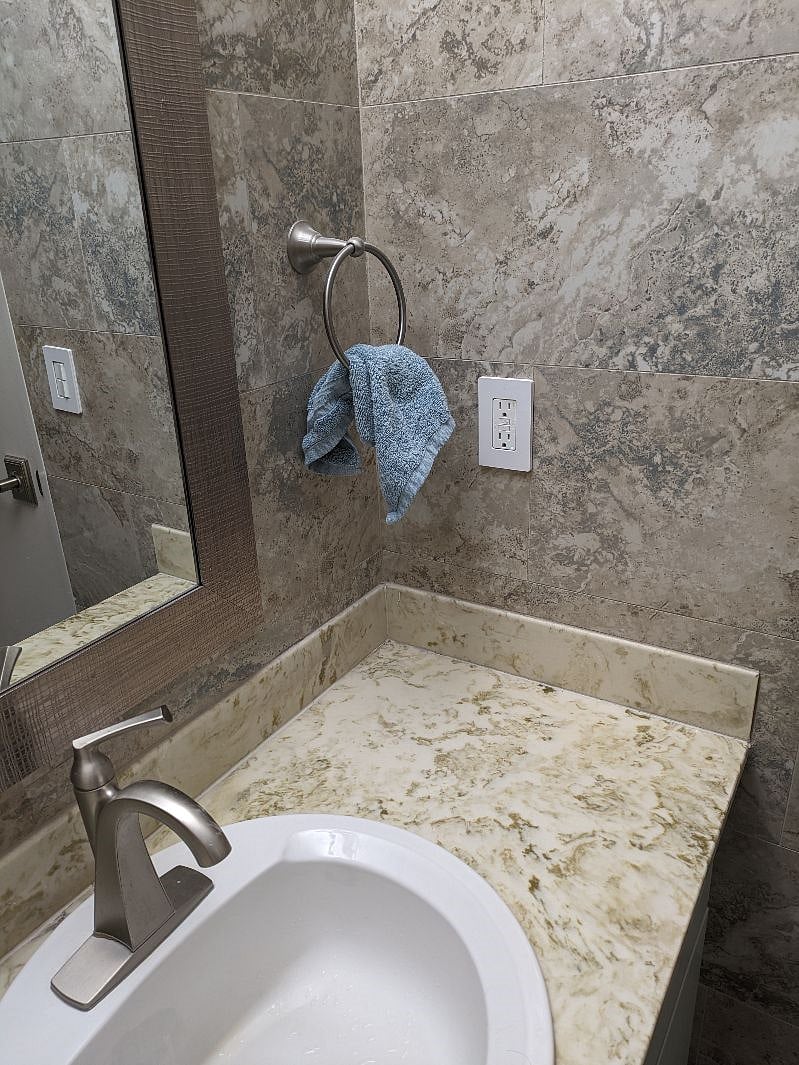Shared Bathroom One - Single Sink and Vanity space.