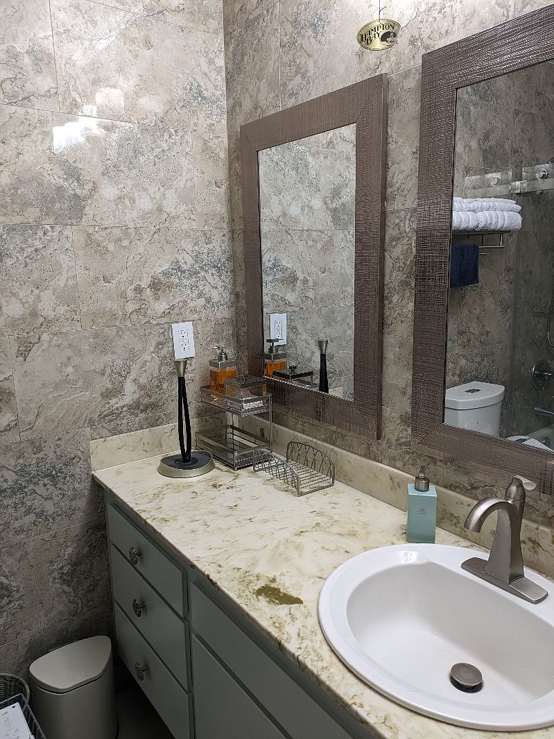 Shared Bathroom One - Single Sink and Vanity space.