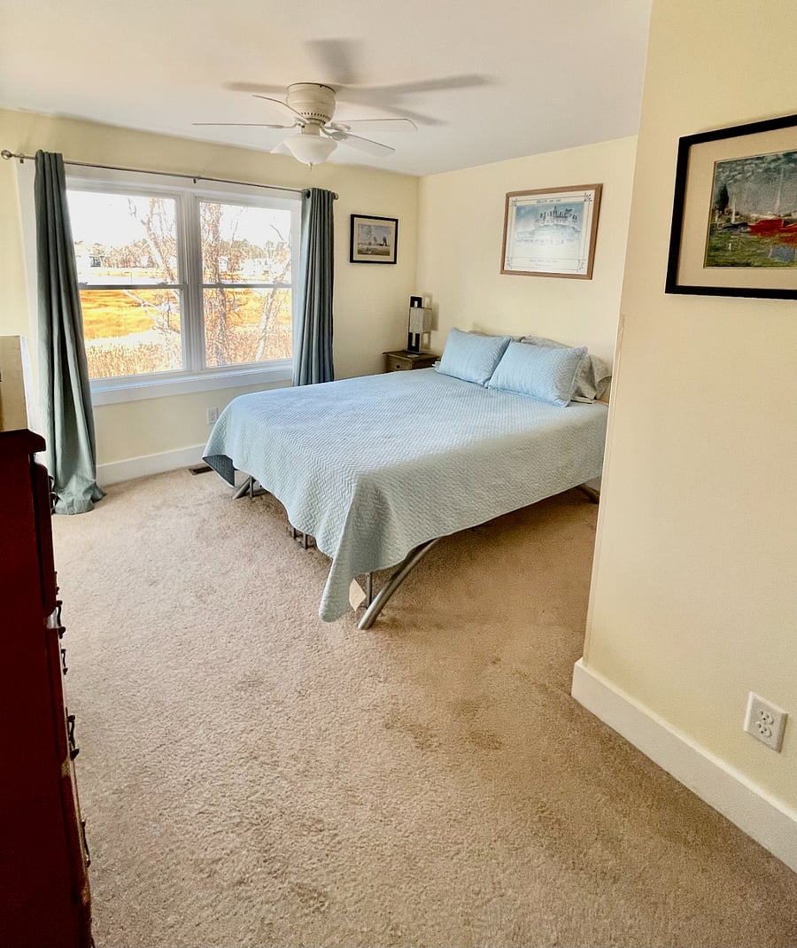 Master bedroom (Queen) w/ private bathroom & covered outdoor porch overlooking beautiful Meadow pond and all it's wildlife!