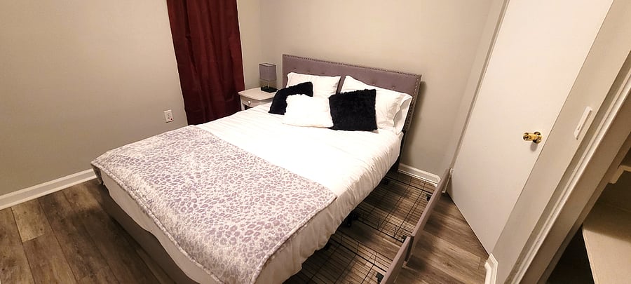 Bedroom 3 with black out shades and underbed storage drawers and large closet.