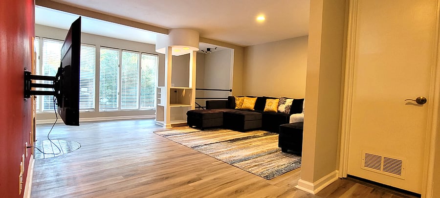 Upstairs living room with plenty of seating and storage in each compartment. 65 in TV 