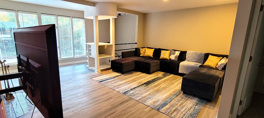 upstairs living room with 65 in smart TV