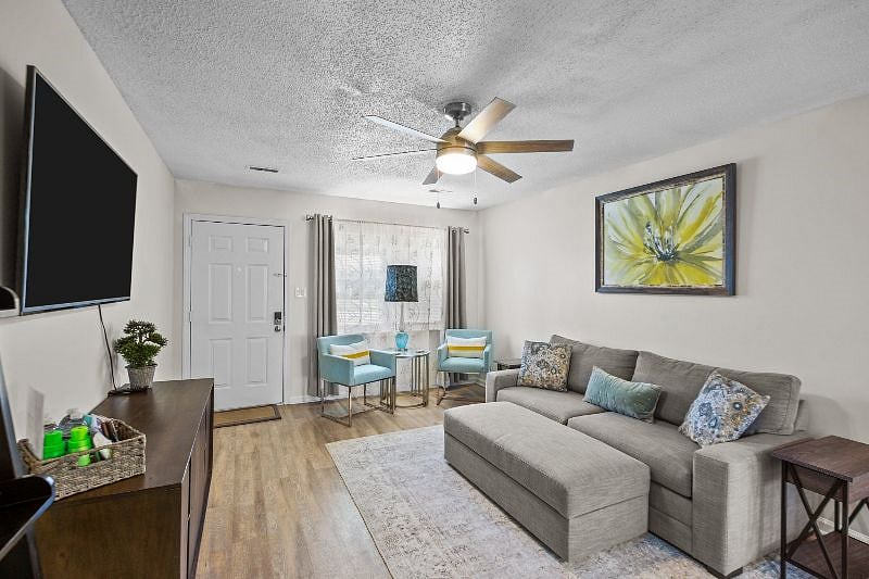 Living room with 55 inch Smart TV
Both end tables have a charging station with outlets and USB outlets.